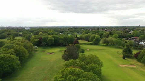 Mowed lawn lined with trees on golf course Stock Footage 159153760