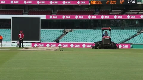 Mower is mowing the cricket grounds Stock Footage 52335568