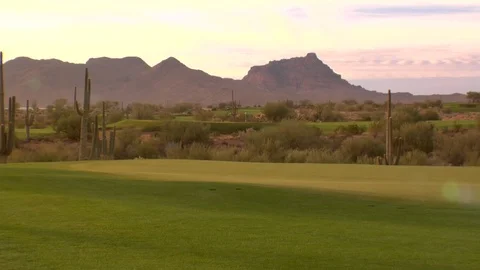 Mowing grass golf course mountains desert Stock Footage 125278013