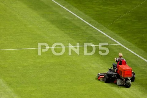 Mowing grass Stock Photos