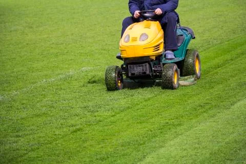 Mowing the grass Stock Photos