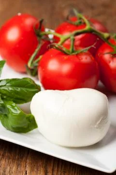 Mozarella, basil and tomatoes Stock Photos