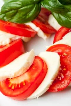Mozarella, basil and tomatoes Stock Photos