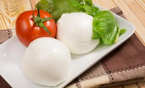 Mozzarella and tomatoes Stock Photos