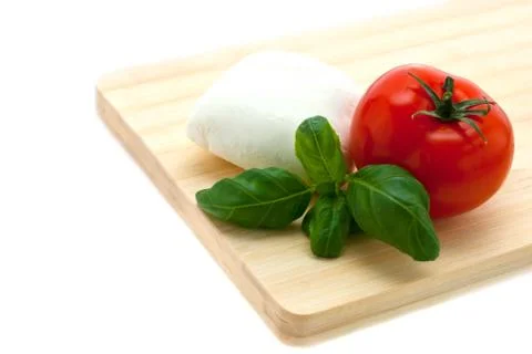 Mozzarella, basil, tomato Stock Photos