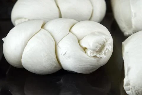 A mozzarella braid, typical Apulian cheese Stock Photos