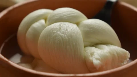 Mozzarella braided in its serum Stock Footage 133095829