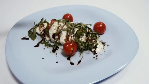 Mozzarella cheese. Dish with mozzarella cheese. Shot in slow motion.. Stock Footage 128939747