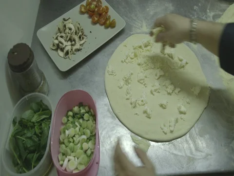 Mozzarella cheese on pizza dough 7 Stock Footage 80674391