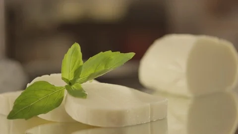 Mozzarella cheese slices with falling basil RAPID 100fps (FEW SHOTS) Stock Footage 74655360