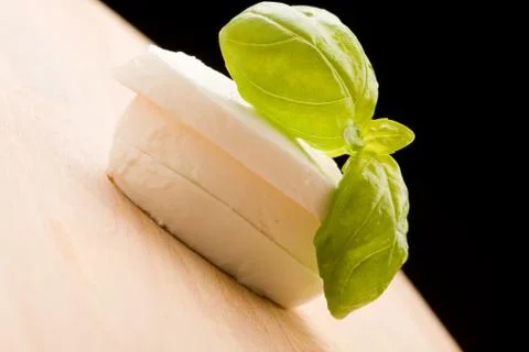 Mozzarella slices with basil leaf Stock Photos