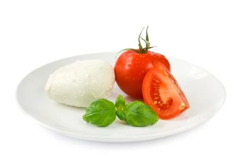 Mozzarella tomato and basil Stock Photos