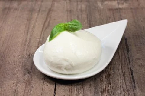 Mozzarella on wooden table Stock Photos