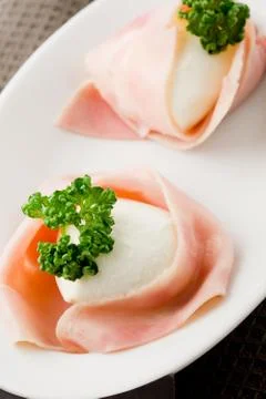 Mozzarella with wrapped ham Stock Photos