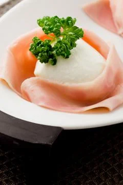 Mozzarella with wrapped ham Stock Photos