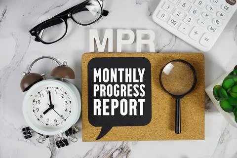 MPR Monthly Progress Report text with Calculator, alarm clock and magnifyin.. Stock Photos