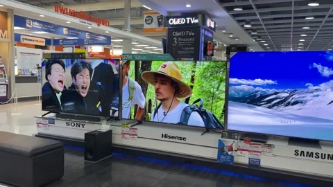 Mr. Beast show playing on large Hisense tv screen in the mall. Shopping concept Stock Footage 232129755