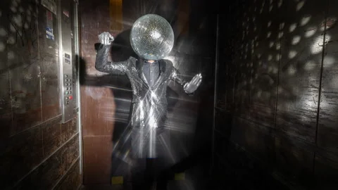 Mr disco ball dancing in a lift Stock Footage 154253543