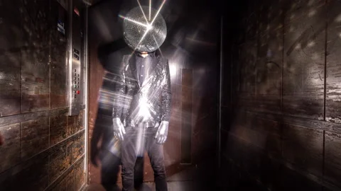 Mr disco ball dancing in a lift Stock Footage 154352157