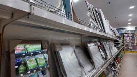 MR DIY store aisle with wrapped mirrors and frames 스톡 동영상 332090578