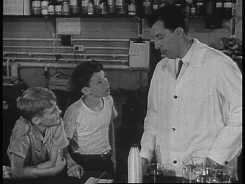 Mr. Norton explains how nylon fibers are made into stockings, in 1949. Stock Footage 83223894