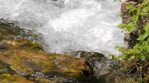 MREZ 23 Clean fresh sparkling water flowing over green rocks 2 Stock Footage 39740761