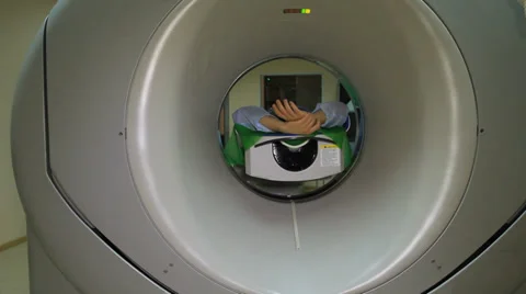 MRI (CT) scanning process (rolling with patient) Stock Footage 39945076