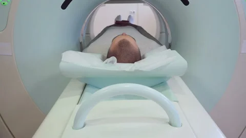 MRI diagnosis of adult man in hospital Stock Footage