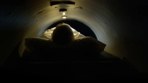 MRI machine -  man being pulled into have test done Video stock 72969696