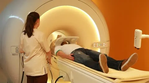 MRI scan performed on patient - medium shot Stock Footage 12518598
