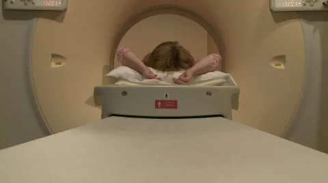 MRI table move toward camera with woman Stock Footage 693859