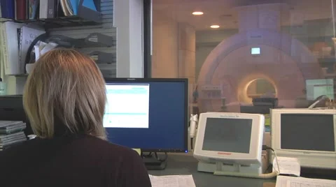 MRI technologist in control room Stock Footage 49615670
