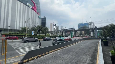 MRT-3 Train and Urban Traffic in Ortigas, Mandaluyong 4K 60fps Stock Footage 338278696