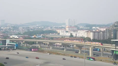 MRT Train Passing by Serdang Raya Utara in Seri Kembangan, Malaysia 스톡 동영상 345967730