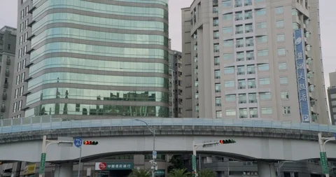 MRT train runs through elevated railway in front of buildings Stock Footage 101952787