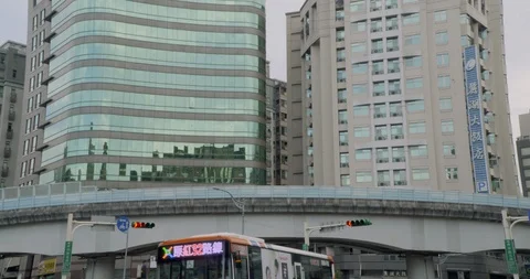 MRT train runs through elevated railway in front of buildings Stock Footage 101953100