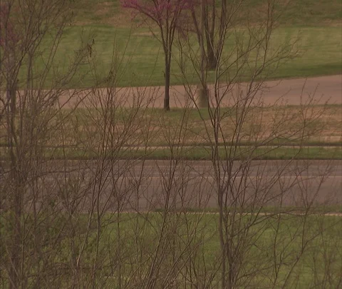 MS car passing over bridge, zoom out XWS of Topeka skyline. Stock Footage 86748596