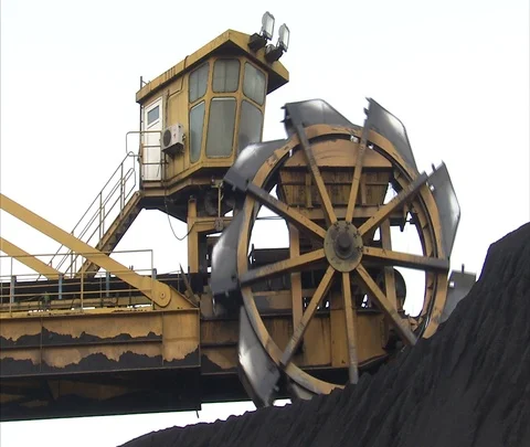 MS coal being dredged from pile outside Shenhua Sanhe power station Stock Footage 86746774