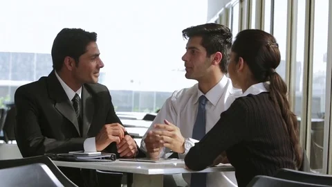 MS Colleagues talking in office / Singapore Stock Footage 69938089