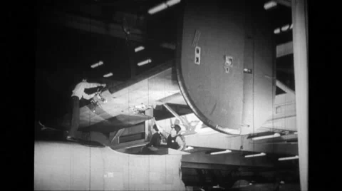MS derrick lowering tail section and workers guiding Stock Footage 39914003