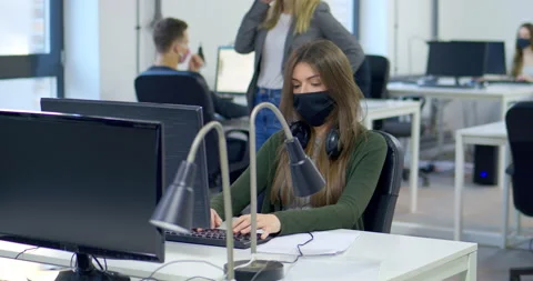 MS DS Office worker putting on protective face mask Stock Footage 145206822