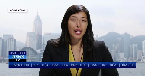 MS Female anchor reporting live from Hong Kong, China with stock market update Stock Footage 113682611