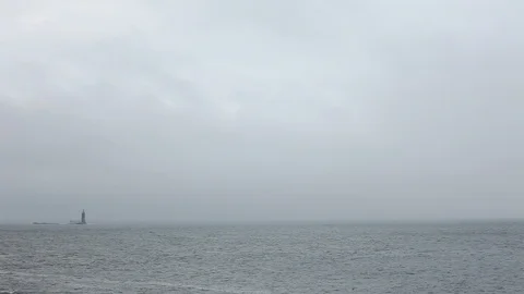 MS Lighthouse, Cloudy Day, Pan From Ocean to Reveal Stock Footage 127254773