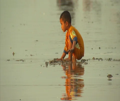 MS little boy playing in wet sand at beach Stock Footage 86747454