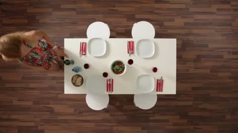 MS, Lockdown of a couple clearing a dining table, overhead view Video stock 10703343