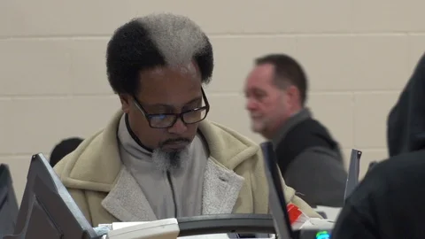 MS Ohio man casts ballot at elelctronic terminal. Stock Footage 106159013