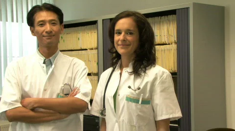 MS PAN OF DOCTORS LOOKING AT A CAMERA Stock Footage 541632