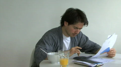 MS PAN OF A MAN SORTING OUT PAPERWORK 스톡 동영상 543197