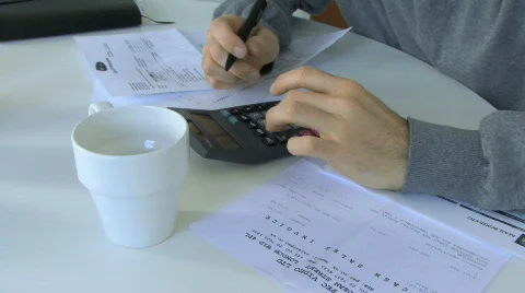 MS PAN OF A MAN SORTING OUT FINANCES 스톡 동영상 543462