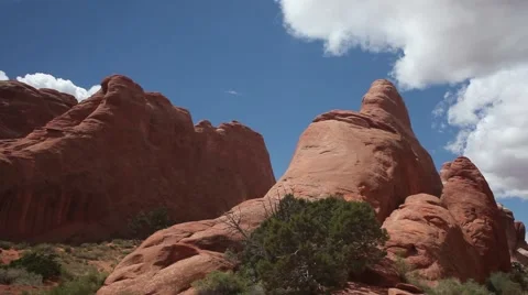 MS pan red rock formations,  Arches National Park, blue sky, white clouds Stock Footage 41751246